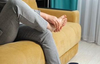 Woman massaging her foot.