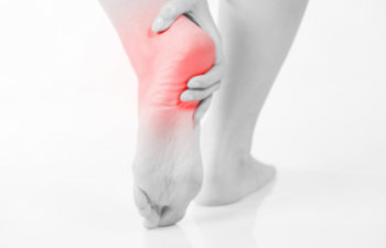female leg with heel pain